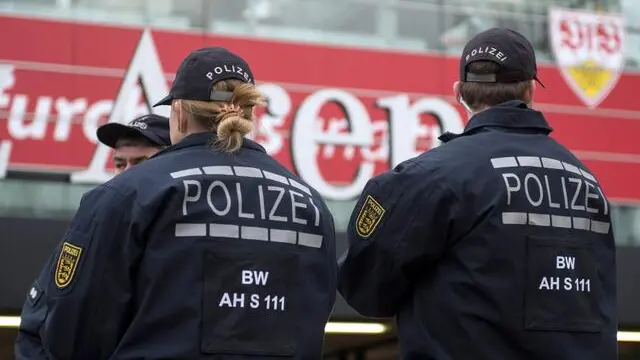 epa05035654 Police officers stand in front of the stadium prior to the German Bundesliga soccer match between VfB Stuttgart and FC Augsburg at the Mercedes-Benz Arena in Stuttgart, Germany, 21 November 2015. (EMBARGO CONDITIONS - ATTENTION: Due to the accreditation guidelines, the DFL only permits the publication and utilisation of up to 15 pictures per match on the internet and in online media during the match.) EPA/Marijan Murat