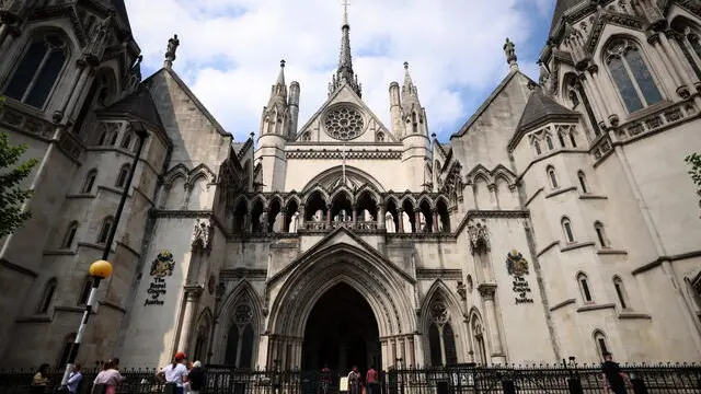 epa12069391 People walk in front of the High Court in London, Britain, 02 May 2025. Britain's Prince Harry has lost his appeal after a judgement at the High Court over his UK security appeal. EPA/ANDY RAIN