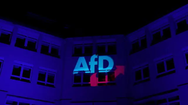 epa11919016 The AFD logo projected onto a building during the Alternative for Germany (AfD) election event in Berlin, Germany, 23 February 2025. About 60 million Germans were eligible to vote in the elections for a new federal parliament, the 20th Bundestag. EPA/FILIP SINGER