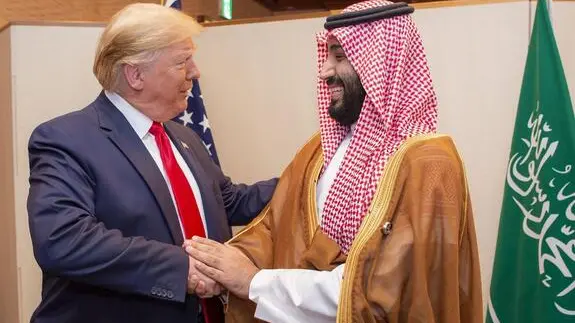 epa07682094 A handout photo made available by the Saudi Royal Court shows Saudi Crown Prince Mohammed bin Salman (R) shaking hands with US President Donald Trump, during a meeting on the sidelines of the G20 summit in Osaka, Japan, 29 June 2019. EPA/BANDAR AL-GALOUD HANDOUT HANDOUT EDITORIAL USE ONLY/NO SALES