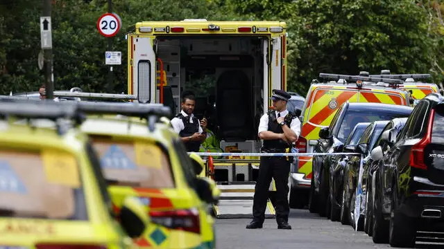 epa10729348 Emergency services work at the site where a car crashed into a primary school in Wimbledon, London, Britain, 06 July 2023. Police said several people were injured when a car drove into the primary school on Camp Road. EPA/TOLGA AKMEN EDITORIAL USE ONLY