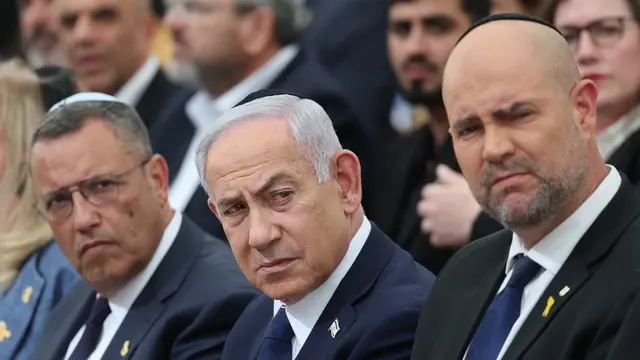 epaselect epa12062488 Israeli Prime Minister Benjamin Netanyahu (C), Parliament Speaker Amir Ohana (R), and Jerusalem Mayor Moshe Leon (L) attend the annual ceremony on the eve of the 'Memorial Day for the Fallen Soldiers of Israel and Victims of Terrorism' (Yom HaZikaron) at the Yad LaBanim Memorial in Jerusalem, 29 April 2025. EPA/ABIR SULTAN / POOL