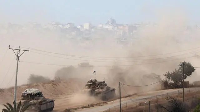epaselect epa11645086 A convoy of Israeli armoured vehicles makes its way to the northern Gaza Strip, as seen from the border with Gaza in southern Israel, 06 October 2024. Israel's military stated on 06 October, they have been conducting since last night an 'operation to systematically dismantle terrorist infrastructure' in the area of Jabalia, in the northern Gaza Strip. The Israel Air Force conducted strikes on dozens of military targets in order to assist IDF ground troops operating in the area, the statement added. EPA/ABIR SULTAN