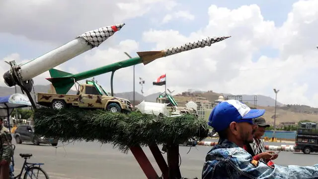 epaselect epa12075517 A person rides a motorcycle decorated with mock missiles along a street in Sana'a, Yemen, 05 May 2025. Yemen's Houthis have announced they will impose a 'comprehensive air blockade' on Israel, warning international airlines that Israel's airports are no longer safe for air traffic, a day after they claimed responsibility for a missile strike that targeted Israel's Ben Gurion airport, according to a statement by Houthi military spokesman Yahya Sarea. EPA/YAHYA ARHAB