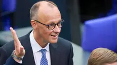 epa12077755 German Chancellor-designate and Christian Democratic Union (CDU) party chairman Friedrich Merz (L) reacts ahead of the second round of voting at the Bundestag in Berlin, Germany, 06 May 2025. The new German government is expected to be formed between the Union parties of Christian Democratic Union (CDU) and Christian Social Union (CSU) and the coalition partner Social Democratic Party (SPD). Merz failed to secure enough votes in the first round of voting to become chancellor. EPA/HANNIBAL HANSCHKE