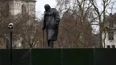 epa08912490 Boarding around Winston Churchill's statue at Parliament Square in London, Britain, 31 December 2020. The government has put up boarding around Trafalgar Square and the statues around parliament square to discourage people from celebrating New Years eve, as coronavirus cases in the UK continue to surge. EPA/ANDY RAIN