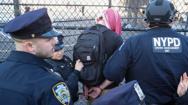 epa11954601 Police arrest a protester as people march in the streets to protest the recent arrest of Columbia university graduate and Palestinian activist Mahmoud Khalil in New York, New York, USA, 10 March 2025. According to court documents, a federal judge in New York has blocked President Donald Trump administration's attempt to deport Khalil. EPA/SARAH YENESEL