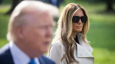 epa12054275 First Lady Melania Trump looks on as US President Donald Trump speaks to the media before departing the White House for Rome, where they will attend Pope Francis' funeral, in Washington, DC, USA, 25 April 2025. In response to reporters' questions, Trump said talks on the the war in Ukraine are 'coming along'. EPA/JIM LO SCALZO