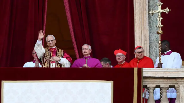 Cardinal Robert Francis Prevost blesses from a balcony of St Peter's Basilica after his election as the 267th pope of the Roman Catholic church, Vatican City, 08 May 2025. ANSA/ETTORE FERRARI