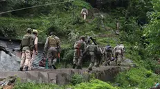 epa12085878 Indian paramilitary soldiers patrol a village in Uri, India-administered Kashmir, 09 May 2025. According to the Indian Ministry of Defense, on the night of 07 and 08 May 2025, Pakistan attempted to engage a number of military targets in northern and western India using drones and missiles, and in response, Indian armed forces targeted air defence radars and systems at a number of locations in Pakistan. EPA/FAROOQ KHAN