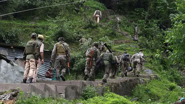 epa12085878 Indian paramilitary soldiers patrol a village in Uri, India-administered Kashmir, 09 May 2025. According to the Indian Ministry of Defense, on the night of 07 and 08 May 2025, Pakistan attempted to engage a number of military targets in northern and western India using drones and missiles, and in response, Indian armed forces targeted air defence radars and systems at a number of locations in Pakistan. EPA/FAROOQ KHAN