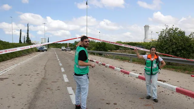 epa12072584 Airport security staff inspect the damage caused by a ballistic missile fired from Yemen at the Ben Gurion airport near Tel Aviv, Israel, 04 May 2025. According to Israel's military spokesperson, a ballistic missile fired from Yemen hit at the Ben Gurion airport. Yemen's Houthis have claimed responsibility for launching the missile. EPA/ABIR SULTAN
