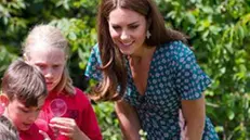 epa07687653 Britain's Catherine, Duchess of Cambridge visits The Back To Nature Garden with children during the press day of the RHS Hampton Court Palace Garden Festival in London, Britain, 01 July 2019. The RHS Hampton Court Palace Garden Festival is a garden show held for five days by the Royal Horticultural Society in the grounds of Hampton Court Palace and runs this year from 02 July to 07 July. EPA/VICKIE FLORES