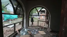 epa12085841 A Kashmiri villager inspects a house damaged after cross-border shelling from Pakistan, at Gingal village in Uri, India-administered Kashmir, 09 May 2025. According to the Indian Ministry of Defense, on the night of 07 and 08 May 2025, Pakistan attempted to engage a number of military targets in northern and western India using drones and missiles, and in response, Indian armed forces targeted air defence radars and systems at a number of locations in Pakistan. EPA/FAROOQ KHAN