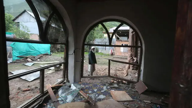 epa12085841 A Kashmiri villager inspects a house damaged after cross-border shelling from Pakistan, at Gingal village in Uri, India-administered Kashmir, 09 May 2025. According to the Indian Ministry of Defense, on the night of 07 and 08 May 2025, Pakistan attempted to engage a number of military targets in northern and western India using drones and missiles, and in response, Indian armed forces targeted air defence radars and systems at a number of locations in Pakistan. EPA/FAROOQ KHAN