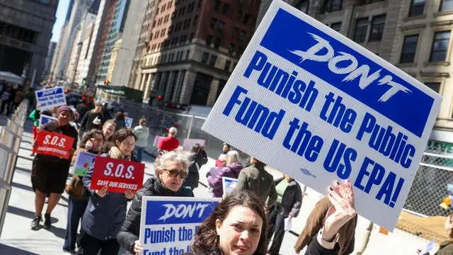 epa11987637 Federal workers, union workers and allies picket against cuts to federal funding and layoffs by CEO of Tesla and senior advisor to the US president Elon Musk, who is working under the Trump administration as part of the Department of Government Efficiency (DOGE), outside of 26 Federal Plaza in New York, New York, USA, 25 March 2025. EPA/SARAH YENESEL