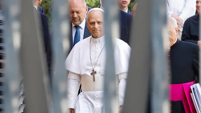 Pope Leo XIV walks inside the Vatican at the end of a meeting with cardinals, Vatican City 10 May 2025. ANSA/FABIO FRUSTACI