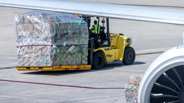 epa12084331 A forklift transports pallets loaded with imported products outside the Avianca Cargo Warehouse at the Miami International Airport, in Miami, Florida, USA, 08 May 2025. During his second presidency, US President Donald Trump significantly expanded the use of protective tariffs, intensifying his 'America First' trade program. These tariffs were designed to shield US industries from foreign competition, particularly targeting countries like China, but also extending to allies such as Canada, Mexico, and European nations. EPA/CRISTOBAL HERRERA-ULASHKEVICH