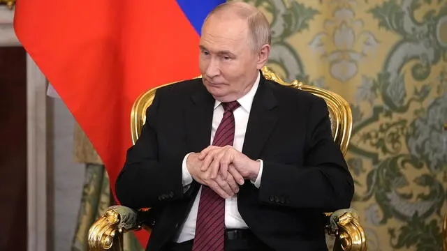 epa12089858 Russian President Vladimir Putin listens to Abkhazian President Badra Gunba during their meeting at the Grand Palace in the Kremlin, Moscow, Russia, 10 May 2025, during celebrations of the 80th anniversary of the Soviet Union's victory over Nazi Germany during the World War II. EPA/PAVEL BEDNYAKOV/AP POOL
