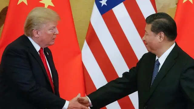 epa06316946 US President Donald J. Trump (L) and Chinese President Xi Jinping (R) shake hands during a press conference at the Great Hall of the People (GHOP) in Beijing, China, 09 November 2017. Trump is on an official visit to China from 08 to 10 November as part of his 12-day tour of Asia. EPA/ROMAN PILIPEY