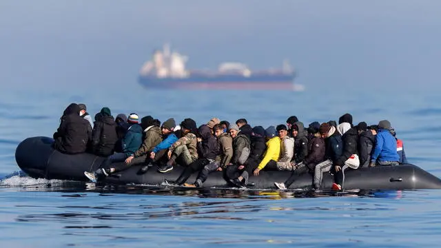 epa11202050 Around 60 migrants cross the English Channel on a small boat, on 06 March 2024. The UK government has suffered more setbacks at the House of Lords recently on its plan to send migrants to Rwanda to deter the Channel crossings. Despite the British and French government's efforts to prevent migrants from making the dangerous journey on small boats, many are willing to take the risk to claim asylum in the UK. EPA/TOLGA AKMEN