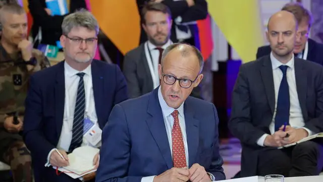 epa12088632 Germany's Chancellor Friedrich Merz (C) speaks during a meeting of the 'Coalition of the willing' at the Mariinskyi Palace, the official residence of the president of Ukraine, in Kyiv, Ukraine, 10 May 2025, amid the ongoing Russian invasion. EPA/SERGEY DOLZHENKO