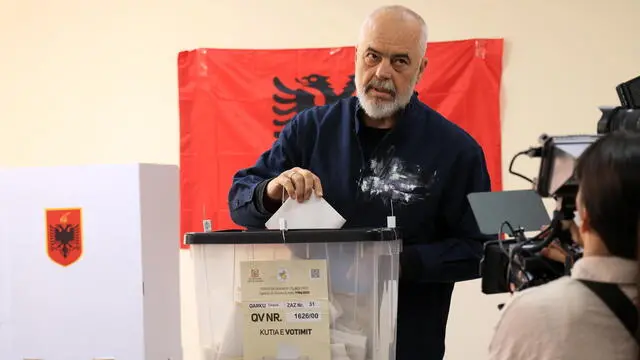 epa12090404 Albania's incumbent Prime Minister and Socialist Party of Albania (PS) chairman Edi Rama casts his ballot during the country's parliamentary elections at a polling station in Tirana, Albania, 11 May 2025. Around 3.9 million eligible voters from both within the country and the diaspora are set to elect 140 members of Parliament, with incumbent prime minister Rama and his ruling Socialist Party (SP) seeking a fourth term. EPA/STRINGER