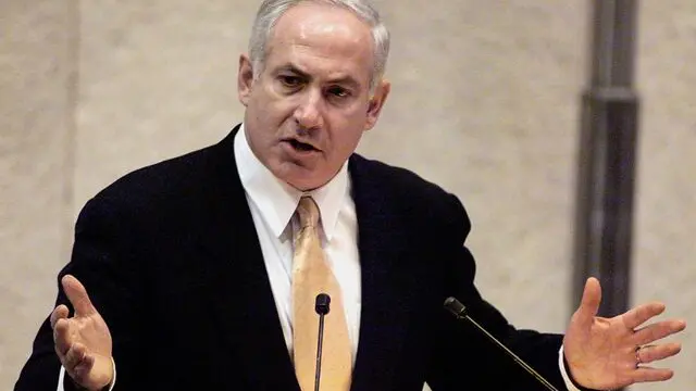 JER05 - 19981221 - JERUSALEM, - : Israeli Prime Minister Benjamin Netanyahu gestures during his policy speach at the Knesset, 21 December. Netnyahu, facing the potential loss of a confidence vote in parliament, called for early elections today. EPA PHOTO AFP/SVEN NACKSTRAND