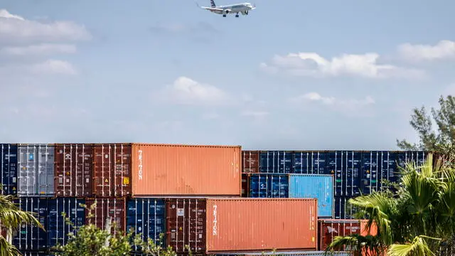epa12084330 Shipping containers are stacked at a container terminal near the Miami International Airport in Miami, Florida, USA, 08 May 2025. During his second presidency, US President Donald Trump significantly expanded the use of protective tariffs, intensifying his 'America First' trade program. These tariffs were designed to shield US industries from foreign competition, particularly targeting countries like China, but also extending to allies such as Canada, Mexico, and European nations. EPA/CRISTOBAL HERRERA-ULASHKEVICH
