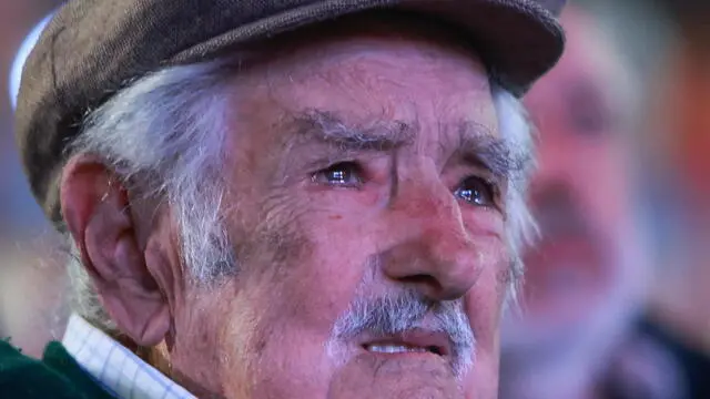 epa11990821 Uruguay's former President, Jose Mujica, reacts during his tribute during the 54th anniversary of the Frente Amplio political party in Montevideo, Uruguay, 26 March 2025. EPA/GASTON BRITOS