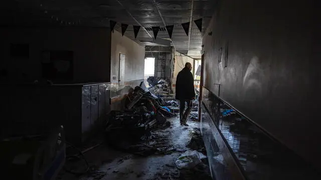 epa11984999 A Palestinian man walks along a corridor of the damaged surgical building of the Nasser Hospital, a day after it was targeted by Israeli strikes, in Khan Yunis, southern Gaza Strip, 24 March 2025. Israeli forces resumed airstrikes on Gaza on 18 March, ending a ceasefire that had been in place since 19 January. More than 50,000 Palestinians have been killed in the Gaza Strip, according to the Palestinian Ministry of Health, since Israel launched a military campaign in the strip in response to a cross-border attack led by the Palestinian militant group Hamas on 07 October 2023, in which about 1,200 Israelis were killed and more than 250 taken hostage. EPA/HAITHAM IMAD