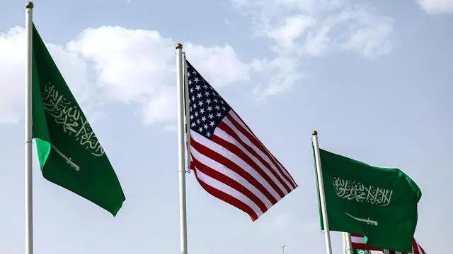 epa12094080 The flags of Saudi Arabia and the US (C) flutter ahead of the US president's visit, in Riyadh, Saudi Arabia, 12 May 2025. The US President Donald Trump will start his visit to the Arabian Gulf region on 13 May 2025, with stops in Qatar and the United Arab Emirates and starting from Riyadh, where he is expected to attend a meeting with the leaders of the Gulf Cooperation Council (GCC). EPA/ALI HAIDER
