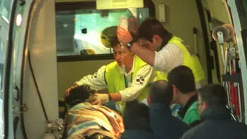SS12 -20010222 - SAN SEBASTIAN, SPAIN: One of six wounded people receives first aid in an ambulance car after a suspected ETA car bomb attack on the vehicle of local Socialist councillor Ignacio Dubreyl in the Basque town of Ordizia, near San Sebastian on Thursday 22 February 2001. Ignacio Dubreyl was rushed to hospital where doctors said he suffered minor injuries. Two passer-by were killed in the car bomb attack opposite Martutene station, hospital sources said. EPA PHOTO EFE/JAVIER ECHEZARRETA