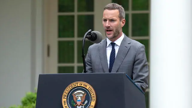 epa08363269 Adam Boehler, CEO of US International Development Finance Corporation, delivers remarks during a news conference in the Rose Garden of the White House in Washington, DC, USA, 14 April 2020. Trump announced that he has instructed his administration to halt funding to WHO, the World Health Organization. EPA/Stefani Reynolds / POOL
