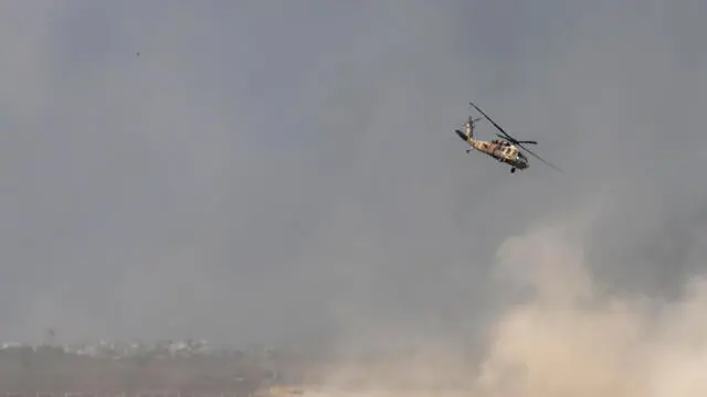 epa11339592 An Israeli military helicopter lifts wounded soldiers from an area next to the northern border with the Gaza Strip, as seen from the Israeli side of the border, southern Israel, 14 May 2024. The Israeli military stated on 14 May, that Israeli troops 'expanded' their activity in the area of Jabalia overnight, and conducted 'targeted operations' in the area. More than 35,000 Palestinians and over 1,455 Israelis have been killed, according to the Palestinian Health Ministry and the Israel Defense Forces (IDF), since Hamas militants launched an attack against Israel from the Gaza Strip on 07 October 2023, and the Israeli operations in Gaza and the West Bank which followed it. EPA/ATEF SAFADI