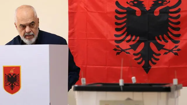 epa12090400 Albania's incumbent Prime Minister and Socialist Party of Albania (PS) chairman Edi Rama prepares to cast his ballot during the country's parliamentary elections at a polling station in Tirana, Albania, 11 May 2025. Around 3.9 million eligible voters from both within the country and the diaspora are set to elect 140 members of Parliament, with incumbent prime minister Rama and his ruling Socialist Party (SP) seeking a fourth term. EPA/STRINGER