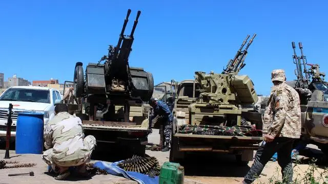 epa07494416 Militants, reportedly from the Misrata militia, stand on gun-mounted vehicles as they prepare to move to the frontline to join forces loyal to the UN-backed unity government, in Tripoli, Libya, 09 April 2019. Commander of the Libyan National Army (LNA) Khalifa Haftar on 04 April ordered Libyan forces loyal to him to take the capital Tripoli, held by a UN-backed unity government, sparking fears of further escalation in the country. The UN said thousands had fled the fighting in Tripoli, while ministry of health reported 25 people, including civilians, were killed in the fighting. EPA/STRINGER