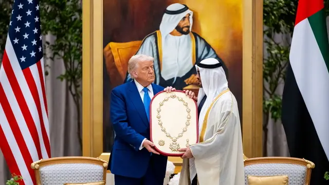 epa12104064 A handout photo made available by the UAE's Presidential Court shows Sheikh Mohamed bin Zayed Al Nahyan (R), President of the United Arab Emirates and Ruler of emirate of Abu Dhabi, presents the Order of Zayed Medal to US President Donald Trump (L) during the official reception during his visit to Abu Dhabi, United Arab Emirates, 15 May 2025. EPA/UAE PRESIDENTIAL COURT / HANDOUT HANDOUT EDITORIAL USE ONLY/NO SALESHANDOUT EDITORIAL USE ONLY/NO SALESHANDOUT EDITORIAL USE ONLY/NO SALES