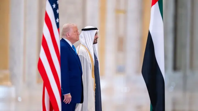 epa12103983 A handout photo made available by the UAE's Presidential Court shows Sheikh Mohamed bin Zayed Al Nahyan (R), President of the United Arab Emirates and Ruler of emirate of Abu Dhabi, attending the official reception of US President Donald Trump (L) during his visit to Abu Dhabi, United Arab Emirates, 15 May 2025. EPA/UAE PRESIDENTIAL COURT / HANDOUT HANDOUT EDITORIAL USE ONLY/NO SALES