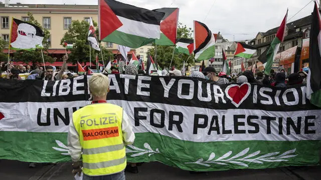 epa12110357 Crowds stage a Pro-Palestine rally at the Barfuesserplatz ahead of the grand final of the 69th Eurovision Song Contest (ESC) in Basel, Switzerland, 17 May 2025. EPA/PETER SCHNEIDER