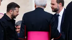 epa12113164 Ukrainian President Volodymyr Zelensky (L) and US Vice President JD Vance during the Holy Mass for Pope Leo XIV inauguration, in St. Peter's Square, Vatican City, 18 May 2025. EPA/FABIO FRUSTACI