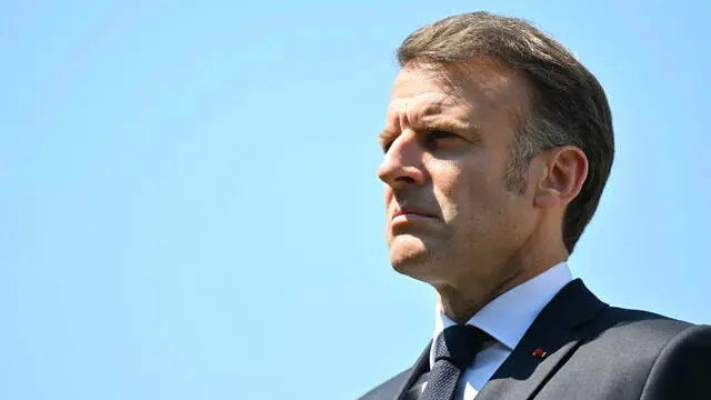 epa12099008 French President Emmanuel Macron pays his respect during a tribute ceremony marking the first anniversary of the death of two prison officers during the attack on an administration van carrying a prisoner, at the Caen prison in Caen-Beaulieu, France, 14 May 2025. One year after the attack on the van carrying French convict and drug trafficker Mohamed Amra at the Incarville toll, Macron is making several visits on the theme of the fight against organized crime and commemorating the event that cost the lives of two prison officers. EPA/LOU BENOIST / POOL MAXPPP OUT