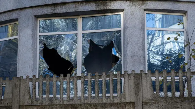 epa11729338 The broken windows of a destroyed building in Kherson, southern Ukraine, 16 November 2024 (issued 19 November 2024). Ukraine marks 1,000 days on 19 November 2024, since Russia's full-scale invasion. In November 2022, Ukrainian troops entered Kherson after the Russian army withdrew from the city, which they had captured at the start of the invasion in February 2022. Since the summer of 2024, the number of Russian artillery and drone attacks on Kherson has increased. These attacks have involved the selective dropping of shells and mines on streets with civilians. EPA/MARIA SENOVILLA