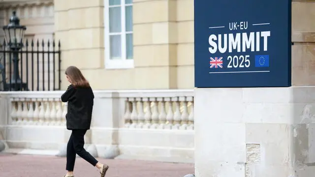 epa12115942 A banner at Lancaster House ahead of EU - UK Summit in London, Britain, 19 May 2025. EPA/JASON ALDEN / POOL