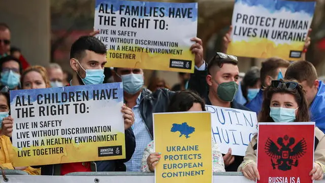 epa09836380 People take part in a demonstration in support for Ukraine organized by Amnesty International – Portugal, near of Russian embassy in Lisbon, Portugal, 19 March 2022. Russian troops entered Ukraine on 24 February resulting in fighting and destruction in the country, and triggering a series of severe economic sanctions on Russia by Western countries. EPA/ANTONIO COTRIM