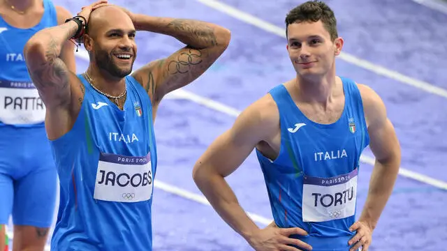 Italy's Filippo Tortu and Lamont Marcell Jacobs react after the Men's 4x100m Relay final of the Athletics competitions in the Paris 2024 Olympic Games, at the Stade de France stadium in Saint Denis, France, 09 August 2024 ANSA/ETTORE FERRARI