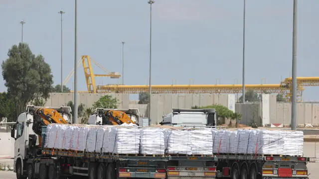 epa12115912 Three aid trucks of the World Food Programme at the Kerem Shalom crossing near the Gaza border, southern Israel, 19 May 2025, after the Israeli cabinet approved the entry of nine aid trucks into Gaza. According to the UN half a million people, or one in five people in the Strip are facing starvation while the entire population of the Gaza Strip continues to face a critical risk of famine following 19 months of conflict, mass displacement and severe restrictions on humanitarian aid. EPA/ABIR SULTAN