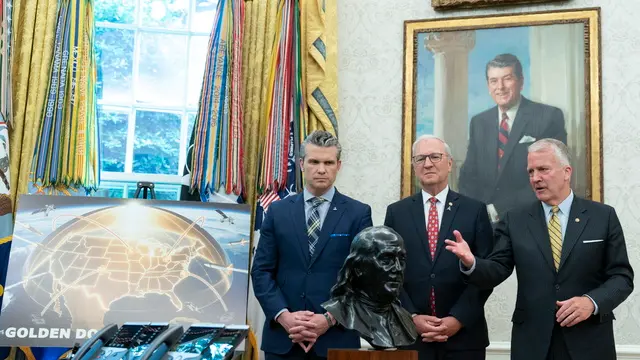 epa12120863 US Secretary of Defense Pete Hegseth (L), United States Senator Kevin Cramer (Republican of North Dakota) (C) and United States Senator Dan Sullivan (Republican of Alaska) (R) participate in an announcement by United States President Donald J Trump about moving forward with the Golden Dome missile defense shield, in the Oval Office of the White House in Washington, DC, USA, 20 May 2025. EPA/CHRIS KLEPONIS / POOL