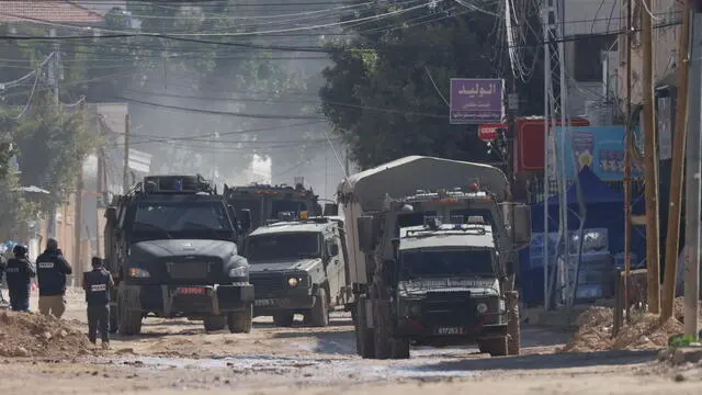 epa11955229 Israeli military vehicles travel along a road during an Israeli military operation in the West Bank city of Jenin, 11 March 2025. According to the Palestinian Ministry of Health, three people were killed so far today during the Israeli military operation in Jenin. The Israeli military launched a military operation in Jenin and its camp on 21 January, resulting in at least 34 Palestinian deaths and dozens of injuries, according to the Palestinian Ministry of Health. EPA/ALAA BADARNEH