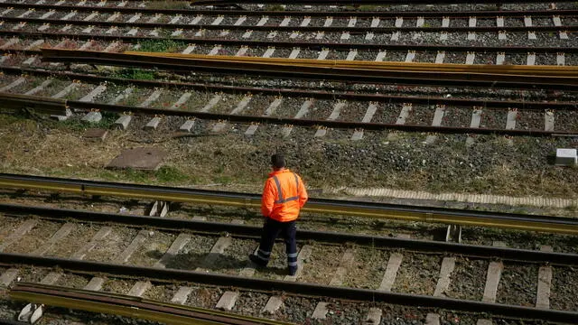 epa11283773 A man crosses the rails in a closed metro station during a 24-hour strike of public transport in Athens, Greece, 17 April 2024. Public transportation (metro, tram, electric railway (ISAP), trolleys and buses) will not run in Athens on 17 April, as workers' unions will participate in a 24-hour strike called by the General Confederation of Employees of Greece (GSEE). EPA/ORESTIS PANAGIOTOU